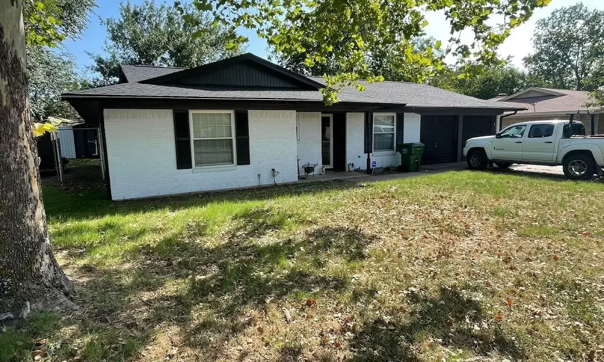 Professional roofing crew working on a residential roof in Wood-Ridge